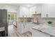 Bright, remodeled kitchen with sleek finishes and stainless steel appliances at 5045 Shadow Wood Dr, Canton, GA 30114