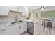 Bright kitchen featuring stainless steel appliances, granite counters, and access to the back deck at 5045 Shadow Wood Dr, Canton, GA 30114