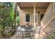 Covered patio with outdoor seating, perfect for relaxing and entertaining at 994 Fairview Club Cir, Dacula, GA 30019