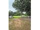Expansive backyard with mature trees and a storage shed at 1797 Chandler Rd, Lawrenceville, GA 30045