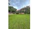 Picturesque backyard with vibrant green grass, mature trees, and a tranquil ambiance, perfect for outdoor enjoyment at 1797 Chandler Rd, Lawrenceville, GA 30045