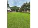 Lush backyard featuring a well-maintained lawn, mature trees, and a serene setting, enhancing the property's appeal at 1797 Chandler Rd, Lawrenceville, GA 30045