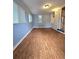 Inviting living room with abundant natural light, wood-look floors, and neutral walls at 1797 Chandler Rd, Lawrenceville, GA 30045