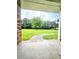 Charming porch view of a sprawling green lawn with a mature tree, creating a peaceful and inviting atmosphere at 1797 Chandler Rd, Lawrenceville, GA 30045