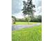 Expansive green yard features mature trees and flowering shrubs, offering a serene and picturesque outdoor space at 1797 Chandler Rd, Lawrenceville, GA 30045