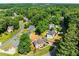 An aerial perspective of the neighborhood, surrounded by dense trees and beautifully maintained lawns at 4913 Farm Valley Ne Dr, Woodstock, GA 30188