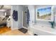 Bright bathroom featuring a soaking tub, separate shower, and large window at 4913 Farm Valley Ne Dr, Woodstock, GA 30188