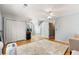Spacious bonus room with hardwood floors, ceiling fan, and ample natural light at 4913 Farm Valley Ne Dr, Woodstock, GA 30188