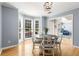 Bright dining room features hardwood floors, bay window, and lovely decor at 4913 Farm Valley Ne Dr, Woodstock, GA 30188