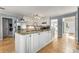 Updated kitchen with granite countertops, stainless steel appliances, and white cabinets at 4913 Farm Valley Ne Dr, Woodstock, GA 30188