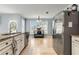 Bright kitchen features tiled floor, stainless steel appliances, granite countertops, and natural light at 4913 Farm Valley Ne Dr, Woodstock, GA 30188