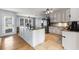 Beautiful kitchen with an island, granite countertops, and stainless steel appliances at 4913 Farm Valley Ne Dr, Woodstock, GA 30188