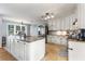 Well-appointed kitchen with granite countertops, an island, and updated appliances at 4913 Farm Valley Ne Dr, Woodstock, GA 30188