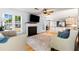 Spacious living room flows into kitchen, with hardwood floors and a fireplace at 4913 Farm Valley Ne Dr, Woodstock, GA 30188