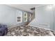 Cozy living room with lots of light, with a decorative rug and neutral paint at 4913 Farm Valley Ne Dr, Woodstock, GA 30188