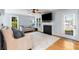 Comfortable living room with fireplace, hardwood floors, and lots of natural light at 4913 Farm Valley Ne Dr, Woodstock, GA 30188