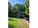 Charming brick two-story home with a well-maintained lawn and mature trees in a quiet neighborhood at 715 Catherine St, Forest Park, GA 30297