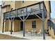 Elevated backyard deck perfect for outdoor dining and relaxing, with stairs leading to the yard at 719 Lilac Mist Dr, Loganville, GA 30052