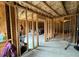 Unfinished basement space with exposed framework, offering flexibility for various finishing options and uses at 719 Lilac Mist Dr, Loganville, GA 30052
