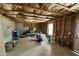 Unfinished basement ready to be customized, featuring exposed framing and ample natural light from the window at 719 Lilac Mist Dr, Loganville, GA 30052