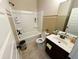 Clean bathroom with shower-tub combination and a single sink vanity and tile floors at 719 Lilac Mist Dr, Loganville, GA 30052