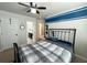 Bedroom boasting stylish ceiling fan, carpeted floors, and easy access to ensuite bathroom at 719 Lilac Mist Dr, Loganville, GA 30052
