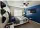 Comfortable bedroom with a ceiling fan, carpeted floor and a window with blinds at 719 Lilac Mist Dr, Loganville, GA 30052