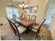Bright dining room with a large wooden table and seating for eight, perfect for entertaining at 719 Lilac Mist Dr, Loganville, GA 30052