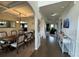 Elegant dining room with a large table, chandelier, and views into the living spaces at 719 Lilac Mist Dr, Loganville, GA 30052