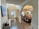 Inviting foyer with hardwood floors, arched doorways, and a view into the dining room at 719 Lilac Mist Dr, Loganville, GA 30052