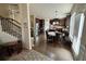 Modern kitchen with stainless steel appliances, dark wood cabinets, and an adjacent dining area at 719 Lilac Mist Dr, Loganville, GA 30052