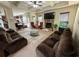 Spacious living room with a coffered ceiling, fireplace, and comfortable seating area at 719 Lilac Mist Dr, Loganville, GA 30052