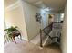 Upstairs hallway with staircase, neutral paint, and views to the downstairs foyer area at 719 Lilac Mist Dr, Loganville, GA 30052