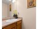 Bathroom featuring a vanity with flowers, a decorated wall, and neutral wall paint at 1777 Cutters Mill Way, Lithonia, GA 30058