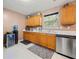 Functional kitchen with stainless steel appliances, wooden cabinets, and a water cooler, perfect for everyday living at 1777 Cutters Mill Way, Lithonia, GA 30058