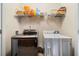 Bright laundry room with modern washer and dryer, plus ample shelving for storage at 1777 Cutters Mill Way, Lithonia, GA 30058
