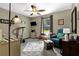 Cozy bedroom with neutral tones, fan, and natural light perfect for relaxation at 3491 Birchwood Trl, Snellville, GA 30078