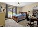 Comfortable bedroom with a bed, a desk, and bright natural light at 3491 Birchwood Trl, Snellville, GA 30078