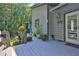 Exterior view of house showing deck with potted plants and a welcome mat at the door at 3491 Birchwood Trl, Snellville, GA 30078