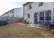 Fenced backyard with brick-paved patio, lawn, and trampoline at 375 Auburn Valley Way, Auburn, GA 30011