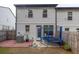 Home's rear exterior shows a brick patio, small trampoline, and fenced yard at 375 Auburn Valley Way, Auburn, GA 30011