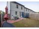 Fenced backyard featuring a grass yard, brick patio and trampoline at 375 Auburn Valley Way, Auburn, GA 30011