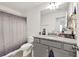 Bathroom with granite countertop vanity and shower at 375 Auburn Valley Way, Auburn, GA 30011