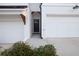 Shot of the entry area between garages leading to the black painted front door at 375 Auburn Valley Way, Auburn, GA 30011