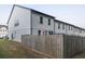 View of the side and back of townhomes with fenced yards at 375 Auburn Valley Way, Auburn, GA 30011