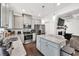 Modern kitchen featuring stainless steel appliances, granite countertops, and a stylish center island at 375 Auburn Valley Way, Auburn, GA 30011