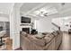 Inviting living room featuring a fireplace, large sectional sofa, and open design at 375 Auburn Valley Way, Auburn, GA 30011