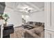 Bright living room with a large sectional sofa and coffered ceiling at 375 Auburn Valley Way, Auburn, GA 30011