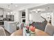 Open-concept living space blending kitchen, dining, and living areas for seamless entertaining at 375 Auburn Valley Way, Auburn, GA 30011