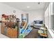 Bright playroom with natural light, comfortable seating, and play area at 375 Auburn Valley Way, Auburn, GA 30011